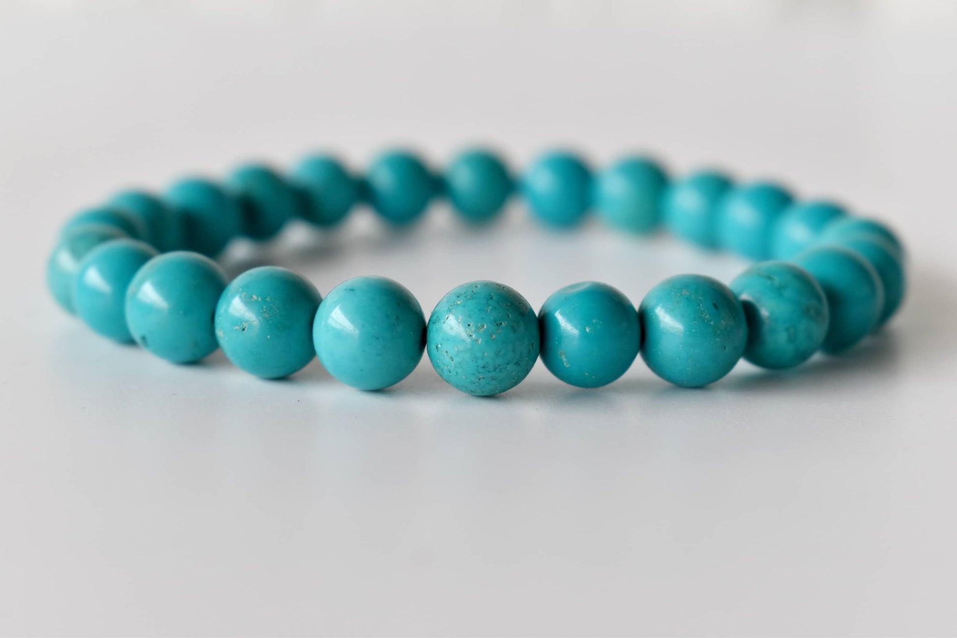 Turquoise beaded bracelet on a white background