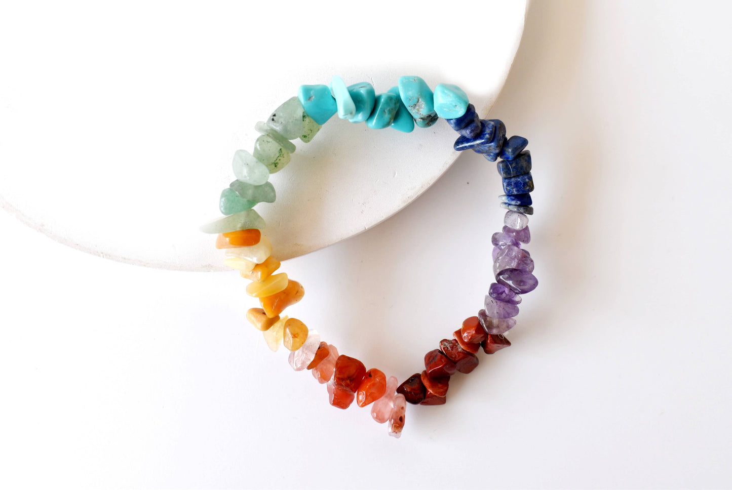 Colorful beaded bracelet on a white surface