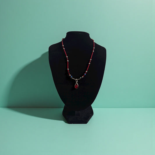 Heart Chakra intention necklace with red micro beads and faux ruby infinity pendant